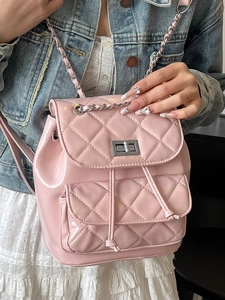 Pink quilted faux leather backpack with chain straps and metallic twist lock closure