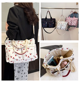Detail view of cherry print tote bag showing multiple pockets and spacious interior