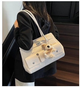 Off-white large capacity underarm tote bag with silver buckles and a cute bear charm