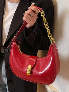 Glossy red minimalist half-moon underarm bag with gold chain strap for women