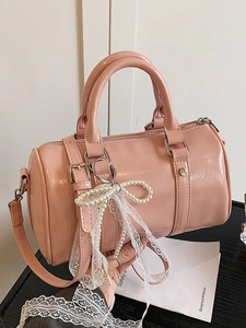 Pink glossy patent leather Boston bag with pearl bow and white lace pendant decoration