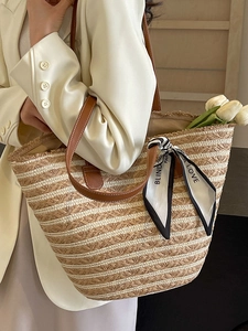 French style woven straw tote bag with brown leather straps and stylish silk scarf detail