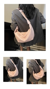 Three-way view of light pink half-moon shoulder bag with wide strap and soft PU leather texture