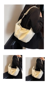 Detailed close-up of large off-white hobo bag showing soft leather texture and stitch lines
