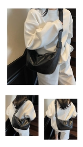Detail view of the black soft leather hobo bag showing its crescent shape and ample capacity