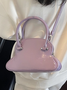 Minimalist lavender patent leather shell bag with top handles and adjustable strap