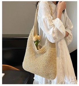 Detailed view of lightweight straw hobo bag with fabric lining for summer vacation
