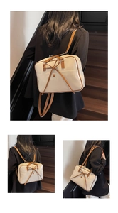 Detail of a creamy white ballet-style bow tote bag showing two-way shoulder straps and texture