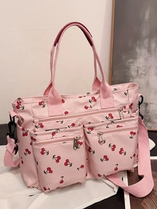 Pink cherry print tote bag with multiple pockets and adjustable shoulder strap