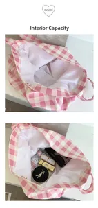 Detailed internal capacity view of pink checkered canvas tote bag with various items