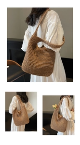 Detail of hand-woven straw tote bag with wide shoulder strap and spacious interior