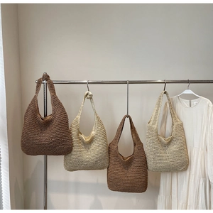 Detailed close-up showing textured straw weave and interior lining of chic beach tote bags