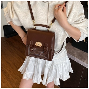 Brown faux leather satchel with transparent window and cartoon embroidery detail
