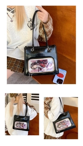 Detail view of the black ita bag with a large transparent window for displaying anime cards
