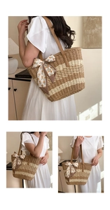 Detail of hand-woven straw bag with striped pattern, leather handle, and floral scarf