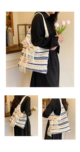 Detail of hand-woven tote bag featuring cream blue stripes and floral lace bow