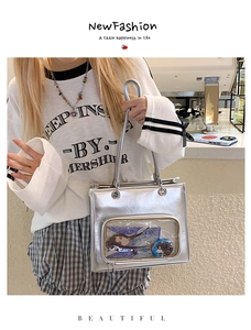 Detail of silver metallic ita bag with a clear PVC window for badge display