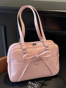 Pink glossy patent leather ballet style tote bag with bow detail and double straps