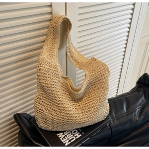 Detailed close-up of handmade straw tote bag showing intricate crochet weave patterns