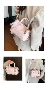 Pink glossy Boston bag with lace bow and silver heart charm shown in three views