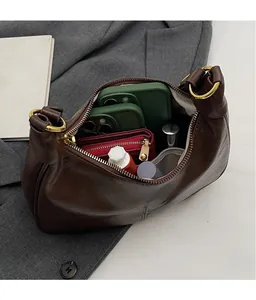 Top view of the spacious inner compartment of this vintage dark brown hobo bag