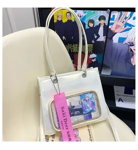 Glossy white oil-wax leather ita bag with a clear front window for display