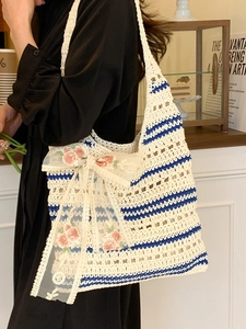 Artistic hollow woven tote bag with blue stripes and delicate lace bow accent