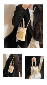 Detail of cream crossbody tote bag with brown leather patch and woven accessory