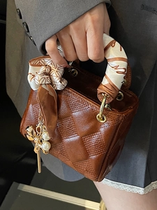 Brown vintage weave mini handbag with decorative scarf and pearl charm accessory