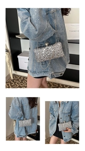 Detail of luxury silver rhinestone clutch bag with crystal flower and pearl clasp