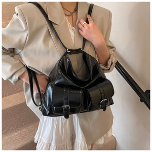 Chic black glossy backpack and shoulder bag with two front metallic buckle pockets