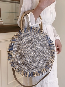 Ethnic bohemian round woven straw bag with tassels and shoulder strap for women