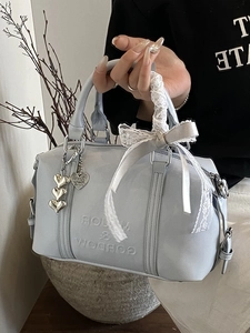 Light blue Boston pillow bag with lace bow and heart charm for elegant women fashion