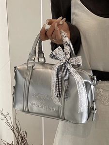 Silver metallic Boston bag with Major & Gordon embossing and elegant lace bow