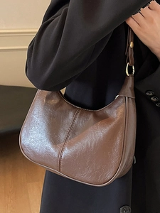 Brown semi-circle leather hobo bag with pleated texture and golden metal buckle