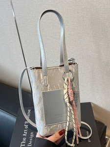 Silver leather crossbody phone bag with marble texture and chic woven pendant