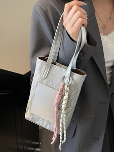 Fashionable silver-grey leather crossbody bag with pleated texture and knot accessory