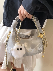 Elegant grey pleated dumpling bag with gold chain strap and white plush charm accessory