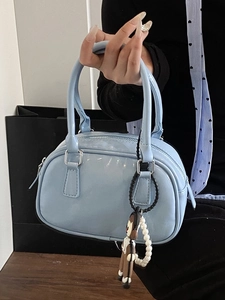 Sky blue glossy bowling bag with cute charm and pearl chain for women