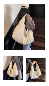 Close-up of cream canvas hobo bag showing spacious interior and zipper closure