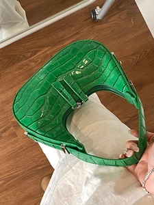 Green crocodile-textured crescent shoulder bag with silver hardware for women