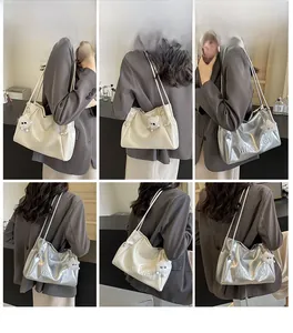 Detail shots of minimalist PU tote bag with letter embossing and cute sheep pendant charm