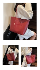 Detail of red leather tote bag with exterior zipper pocket and long shoulder straps