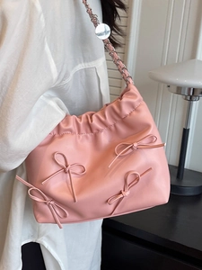 Pink pleated PU leather tote bag with decorative bows and silver chain strap