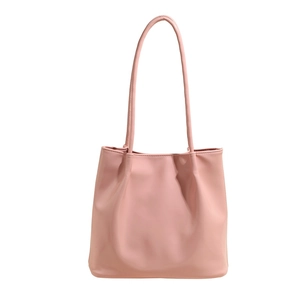 Minimalist pink soft leather tote bag for women featuring a spacious commuter shoulder design