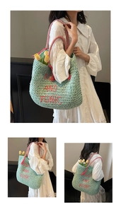 Detail of mint green straw tote with pink SWIM AND TONIC embroidery and tassels