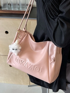 Pink soft PU leather tote bag with MIKAXIQI embossed logo and plush monster keychain