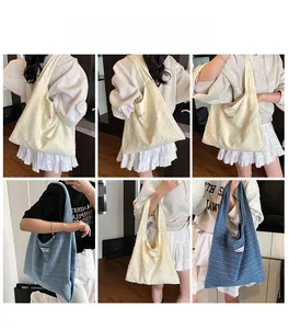 Detail shots of minimalist quilted tote bags in beige and blue for casual daily styling