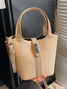 Chic straw bucket handbag in apricot with faux leather strap and metal clasp for summer