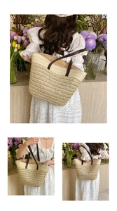 Detail of woven straw tote bag with brown leather handles and large capacity design